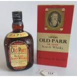 A bottle of Grand Old Parr De Luxe Scotch Whisky,