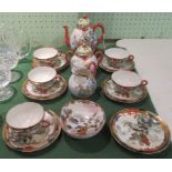 An early 20th century Japanese Eggshell tea service, comprising teapot, twin handled sugar bowl,