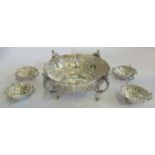 A late Victorian trophy centrepiece and four dishes en suite,