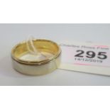 A gentleman's bi-coloured 18 carat gold wedding band, ring size 'V', 9.5g.