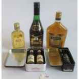 A collection of 5 bottles of various spirits, to include: Napoleon Brandy,