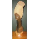 A contemporary carved and polished stone sculpture of an African lady, on wooden socle.