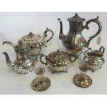 A five piece silver plated tea set, together with a pair of silver plated candlesticks.