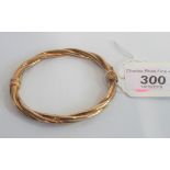 A 9 carat gold rope twist bangle with magnetic clasp, 10.6g.