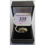 An 18 carat gold and diamond foliate band,