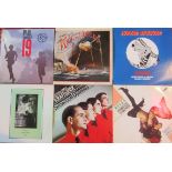 A collection of thirty vinyl records, comprising LP's and 12 inch singles,