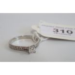 A single stone diamond ring, the princess cut diamond in four claw mount,