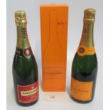 A bottle of Piper-Heidsieck Champagne, together with a bottle of Veuve Clicquot Ponsardin Champagne,