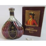 A bottle of XO Courvoisier Cognac, together with a presentation box.