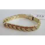 A fancy chevron link bracelet, to concealed box clasp, stamped 585, 16.9g.