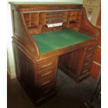 A 20th century oak roll top desk.