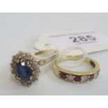 A sapphire cluster ring, the oval cut sapphire within a border of white stones,