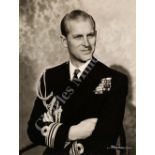 AN AUTOGRAPHED PHOTOGRAPH OF PRINCE PHILIP, CIRCA 1951; together with two others