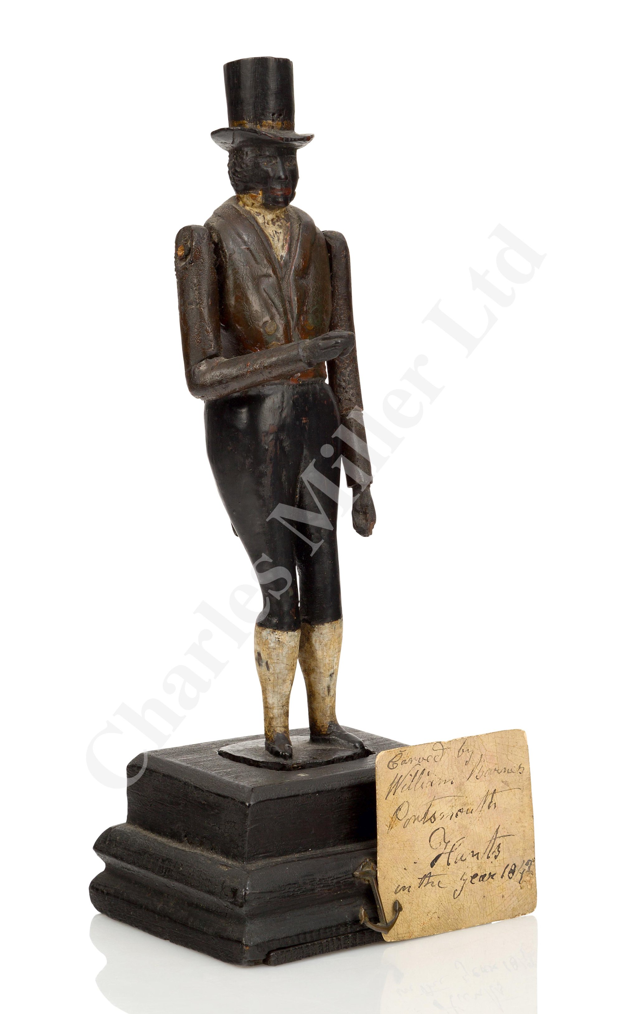 AN UNUSUAL ARTICULATED FIGURINE CARVED FROM TIMBER RECOVERED FROM H.M.S. ROYAL GEORGE, CIRCA 1842