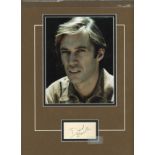 David Carradine signature piece mounted below colour photo. Approx. overall size 16x12. American