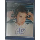 Robbie Williams signed young 10 x 8 colour portrait photo mounted in Blue. Lester Freeman COA.