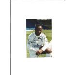 Tony Yeboah signed 6x4 - colour image of the former Leeds striker in kit at Elland Road. Good