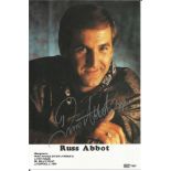 Russ Abbot Entertainer Signed Promo Photo. Good Condition. All signed pieces come with a Certificate