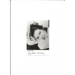 Elizabeth Hurley signed 6x4; black and white shot, signed in black. Good Condition. All signed