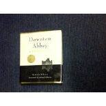 Downton Abbey hardback book titled A Celebration signed inside by cast members Hugh Bonneville,