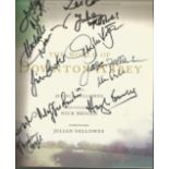 Multi signed The World of Downton Abbey hardback book. Signed on inside title page by 11. Some of