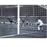 Autographed 16 x 12 photo, IAN ST. JOHN 1965, a superb image depicting St. John heading the