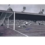 Autographed 16 x 12 photo, NAT LOFTHOUSE 1958, a superb image depicting the Bolton forward scoring