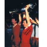 Autographed 16 x 12 photo, IAN CALLAGHAN 1977, a superb image depicting Callaghan holding aloft