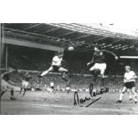 Football Martin Peters 8x12 signed b/w photo pictured in action during the 1966 world cup final.