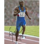 Athletics Linford Christie Signed Athletics 8x10 Photo. Good Condition. All signed pieces come