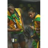 Athletics Usain Bolt 12x8 signed colour photo. Usain St Leo Bolt OJ CD, born 21 August 1986 is a