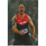 Robert Harting 6x4 signed colour photo Olympic Gold medallist in the Discus for Germany at the