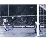 Autographed 16 x 12 photo, ROGER HUNT 1966, a superb image depicting Hunt heading his second goal in