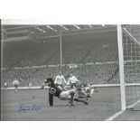 Autographed 12 x 8 photo, DENIS LAW, a superb image depicting an action scene at Wembley - Law looks