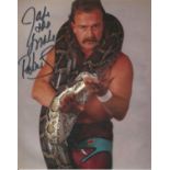 Jake the Snake Roberts WWF hand signed 10x8 photo. This beautiful hand-signed photo depicts WWF