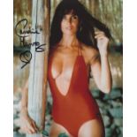 Bond Girl. 8 x 10 inch photo signed by Bond girl Caroline Munro pictured in a sexy red swimsuit.