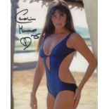 Bond Girl. 8 x 10 inch photo signed by Bond girl Caroline Munro pictured in a sexy blue swimsuit.