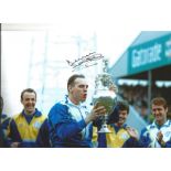 Autographed 12 x 8 photo, MEL STERLAND, a superb image depicting Sterland holding aloft the League