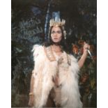 Bond Girl. 8 x 10 inch photo from the film 'Prehistoric Women' signed by actress Martine Beswick.
