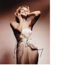 Kylie Minogue Signed 8 x 10 inch Photo. Good Condition. All signed pieces come with a Certificate of