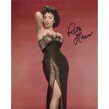Rita Moreno. 8 x 10 inch photo signed by West Side Story actress Rita Moreno. Good Condition. All