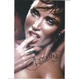 Music Danni Minogue 10x8 signed colour photo. Good Condition. All signed pieces come with a