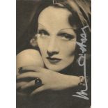 Marlene Dietrich signed 7x5 newspaper photo. Good Condition. All signed pieces come with a