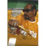 Music Snoop Dogg 12x8 signed colour photo. Calvin Cordozar Broadus Jr., known professionally as