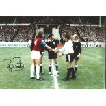 Autographed 12 x 8 photo, BILLY BONDS, a superb image depicting the West Ham captain shaking hands