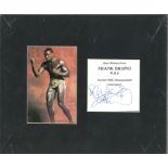 Frank Bruno signature piece mounted alongside colour photo. Approx overall size 12x10. Good