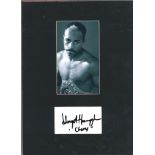 Lloyd Honeyghan signature piece mounted below b/w photo. Approx overall size 14x12. Good