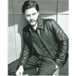 Daniel Bruhl signed 10x8 b/w photo. Good Condition. All signed pieces come with a Certificate of