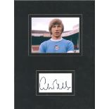 Colin Bell signature piece mounted below colour Manchester City photo. Approx overall size 16x12.