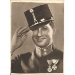 Maurice Chevalier signed 10x7 b/w photo of him in soldier uniform. (September 12, 1888 - January